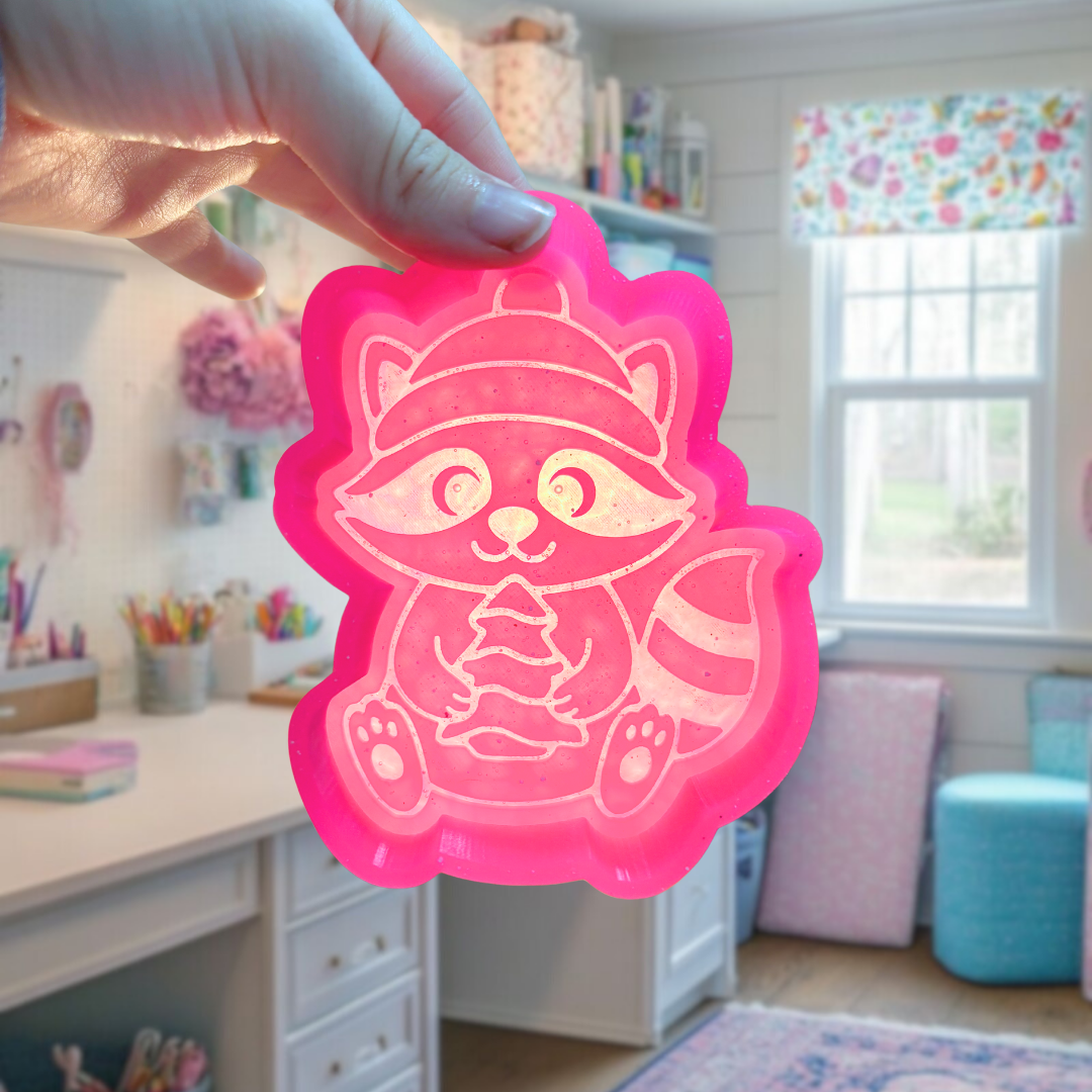 Raccoon with snack cake