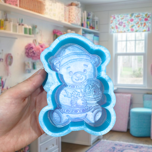Bear with snow globe