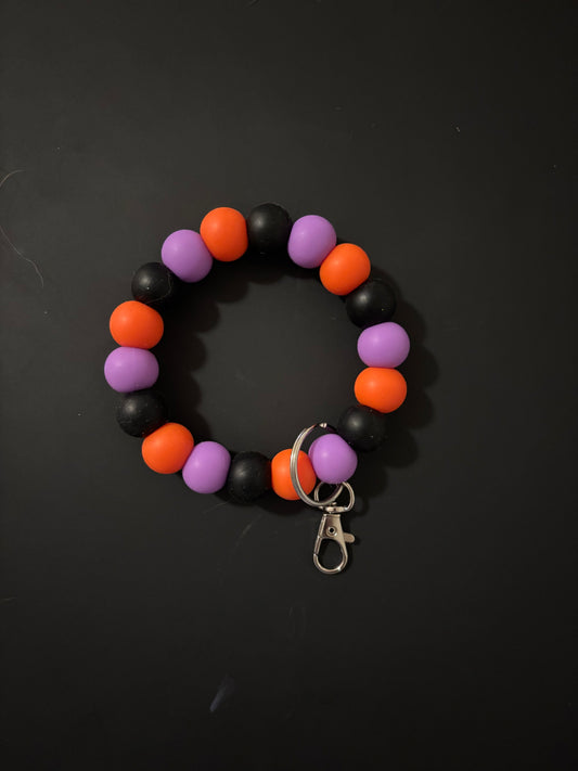 Purple,black and orange wristlet