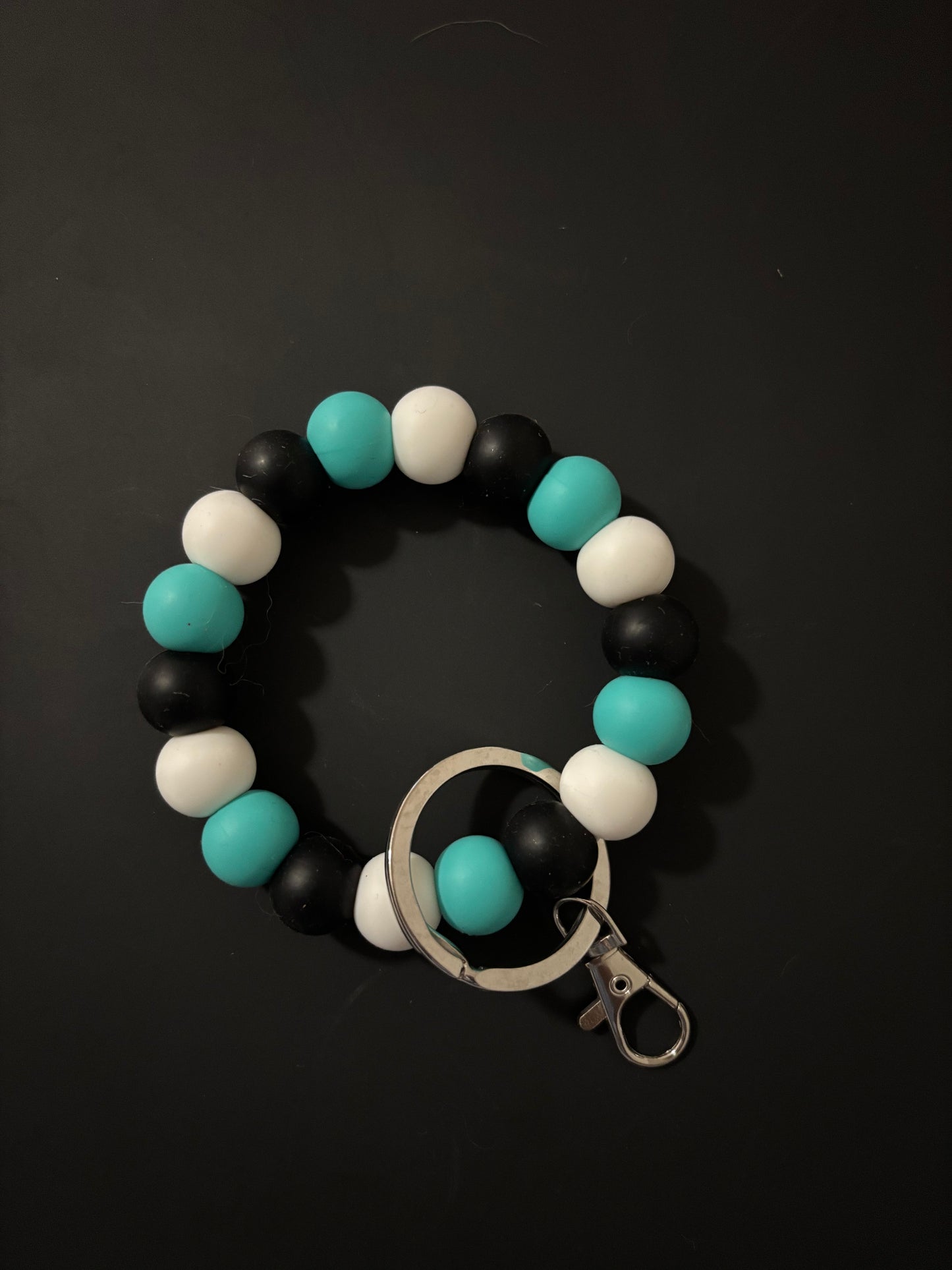 Turquoise, black,and white wristlet